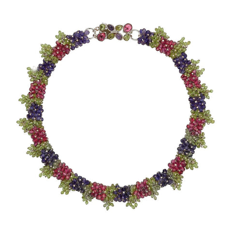 Thin grape collar with green leaves and dark blue and pink grapes and clasp with matching stones. 